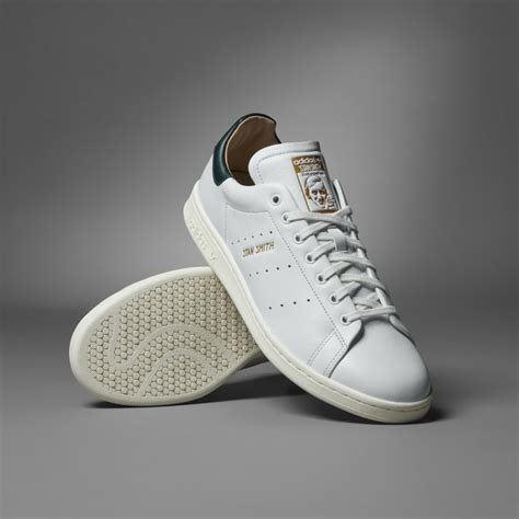 adidas Originals Stan Smith sneakers in white with leopard print .